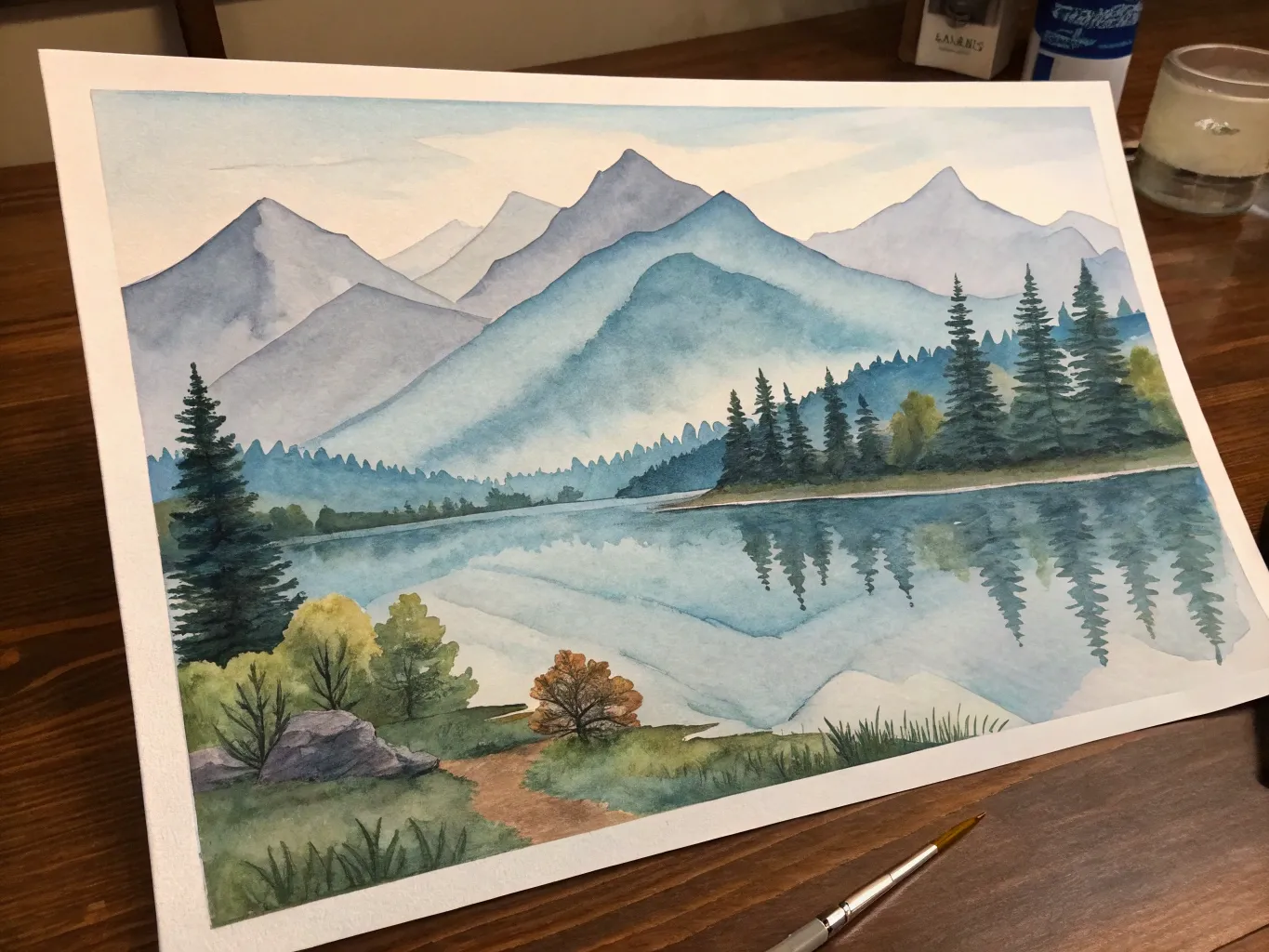 Watercolor painting of a serene landscape with mountains and lake